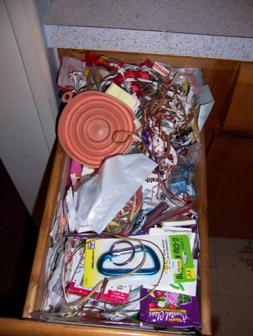 cluttered kitchen drawer